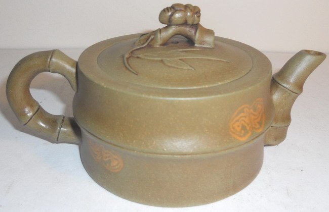 A Chinese Yixing teapot.: A Chinese Yixing teapot, marked. L: 15.3cm (6") Shipping within Canada & continental U.S.A. $25. Shipping to China $45. All other countries, please Email for shipping rates. Combined shipping always a