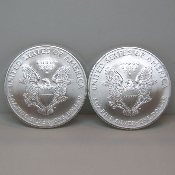 2-Coin Set American Silver Eagles - Unc: Silver American Eagle (2-Coin Set) by The United States Mint. Each Silver Eagle Coin Has a Legal Tender Value of $1 and Contains 1 Oz of .999 Fine Silver. Comes in Brilliant Uncirculated Condition. Da