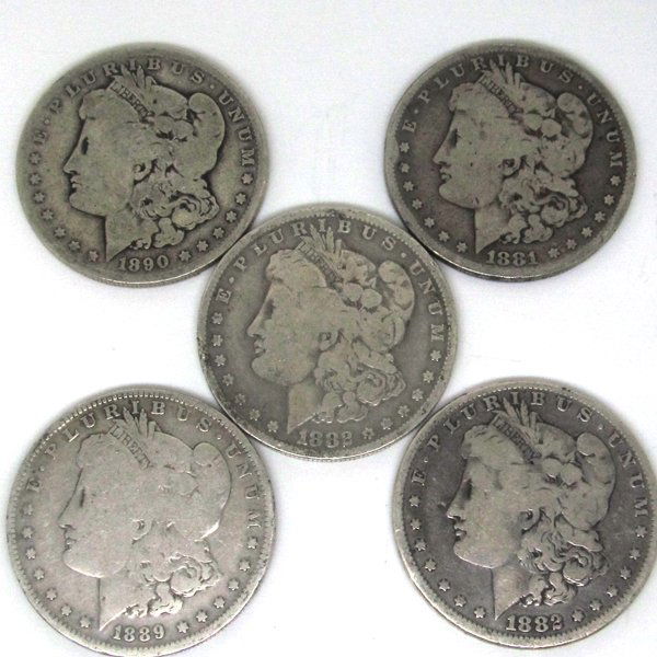 (5) Morgan Silver Dollars: 5 (Five) Morgan Silver Dollars by The United States Mint. 5-Coin Set Comes in AG (Almost Good) to VF (Very Fine) Condition. Dates are Based on in Stock Inventory and are Our Choice!