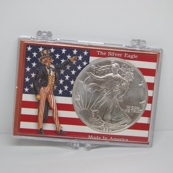 BU Silver Eagle - U.S. Flag & Uncle Sam Snap Lock: 1 Oz Silver American Eagle US Flag and Uncle Sam Snap Lock Display Case. The Silver Eagle Coin Has a Legal Tender Value of $1 and Contains 1 Oz of .999 Fine Silver. Dates are Based on in Stock Invento