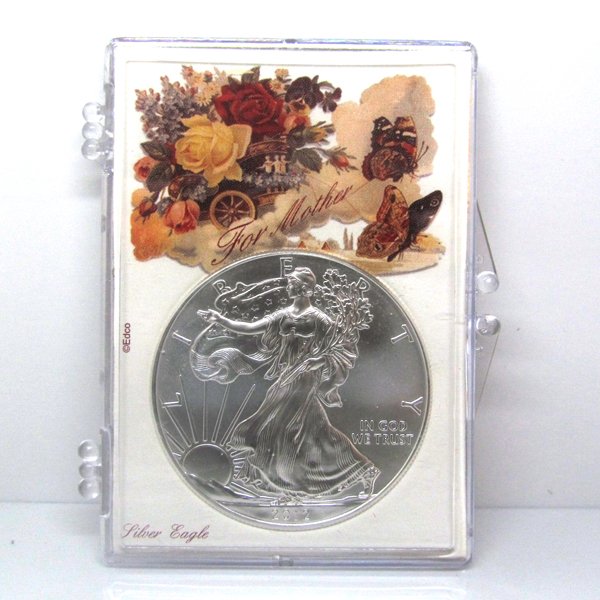 BU Silver Eagle - Mothers Day Butterflies Snap Lock: 1 Oz Silver American Eagle Happy Mothers Day Butterflies Snap Lock Display Case. The Silver Eagle Coin Has a Legal Tender Value of $1 and Contains 1 Oz of .999 Fine Silver. Dates are Based on in Stock