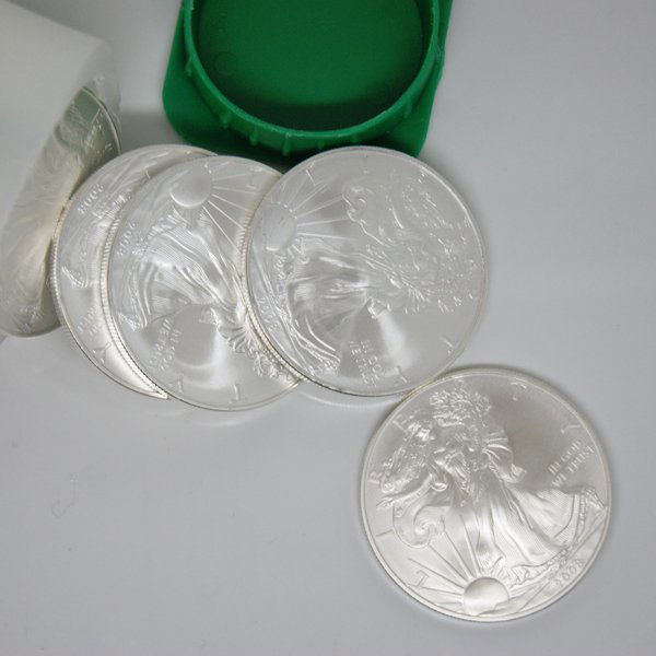 (20) Silver American Eagles - Brilliant Uncirculated: 20 (Twenty) Silver American Eagle Coins by The United States Mint. Each Silver Eagle Coin Has a Legal Tender Value of $1 (One Dollar) and Contains 1 Oz of .999 Fine Silver. 1 (One) Unopened Roll of 20