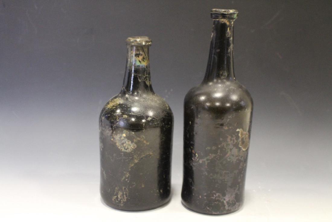 Pair Marine Salvage Bottles: Pair 18th to early 19th century marine salvage bottles, blown amber bottles, tallest 10 3/4". Discolored, no chips, cracks or repairs.