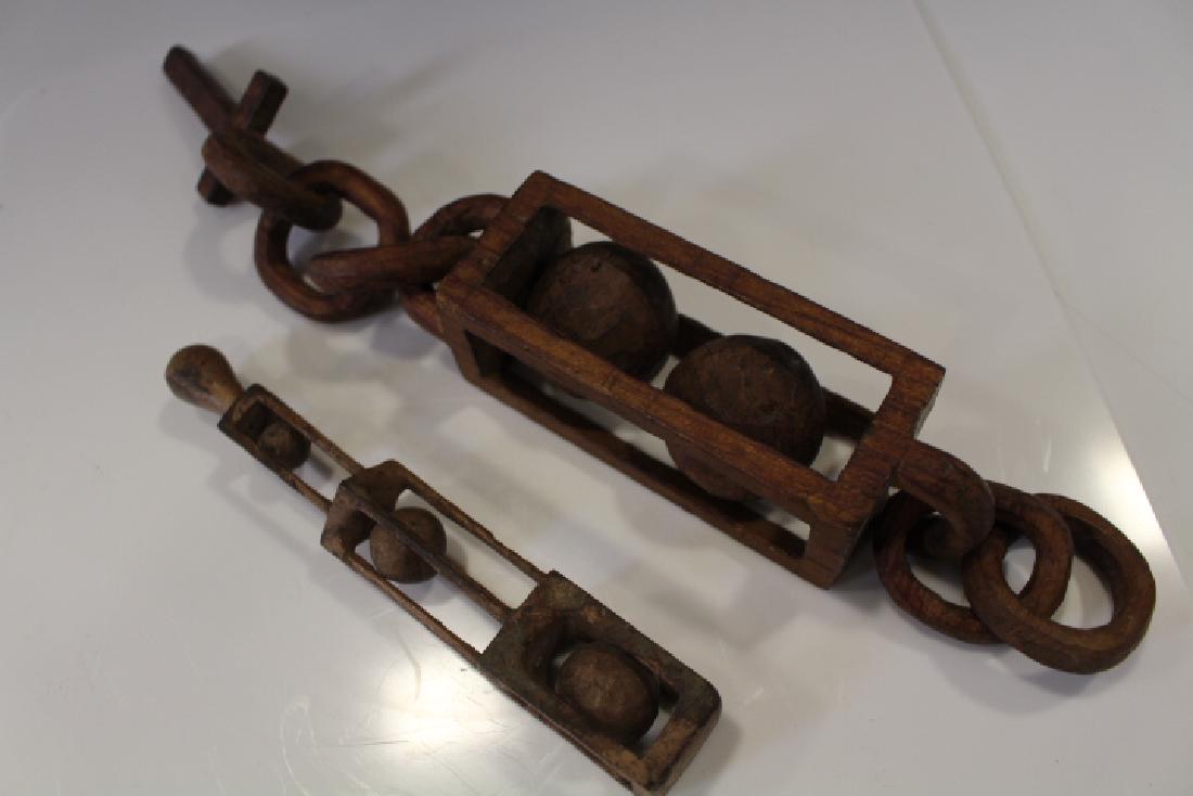 Pair Carved Whimsey Balls and Chains: Pair carved ball and chain whimsey, largest 13". In-house shipping available on this lot.