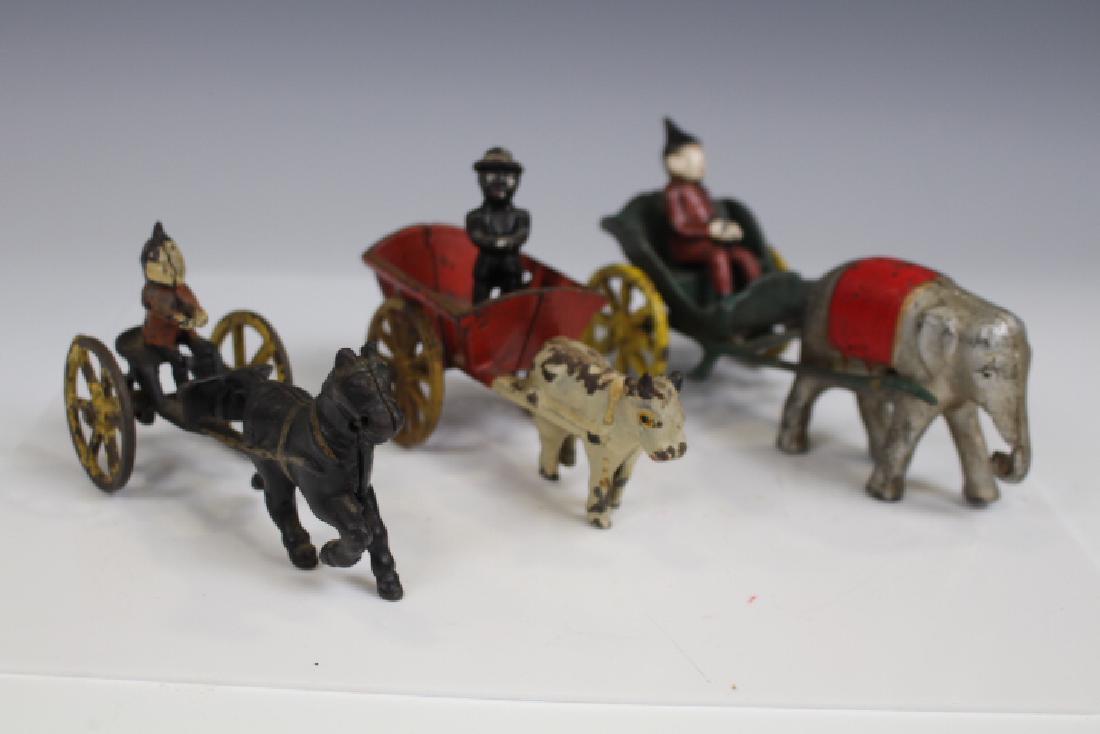 Cast Iron Carts w/ Drivers, Elephant, Cow & Horse (1 of 4)