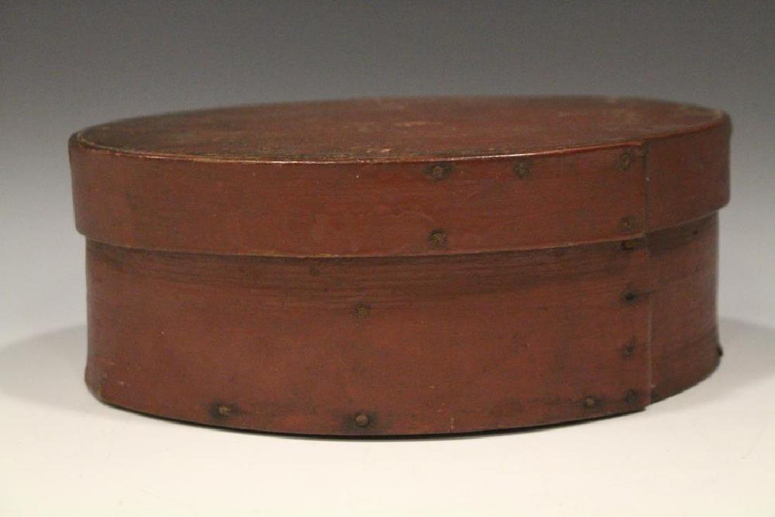 Original Red Paint Oval Pantry Box: Oval red painted pantry box, single lap on lid and base, square cut tacks / nails, 8 3/4" H x 3 1/2" H. One of 30 pantry boxes in this sale - some selling in multiples.