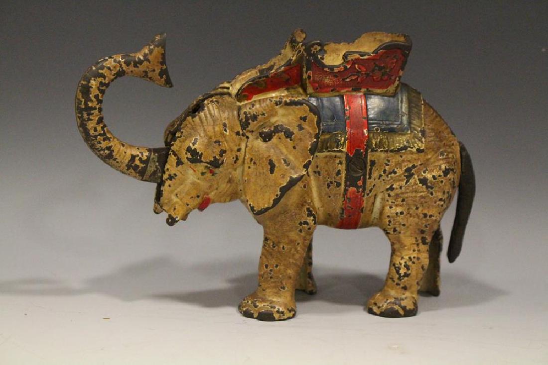 Hubley Elephant Howdah Mechanical Bank: 19th C. Hubley Elephant mechanical bank, carrying howdah on its back, 8" L. Working, chipped paint.