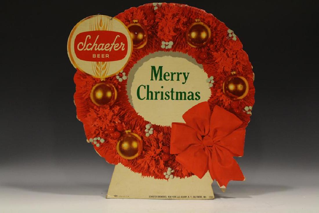 Christmas Wreath Die-Cut Advertisement - Schaefer Beer: Lithographed cardboard easel die-cut "Schaefer Beer" advertisement sign of wreath, "Merry Christmas" 1940-50s, 17" x 17".