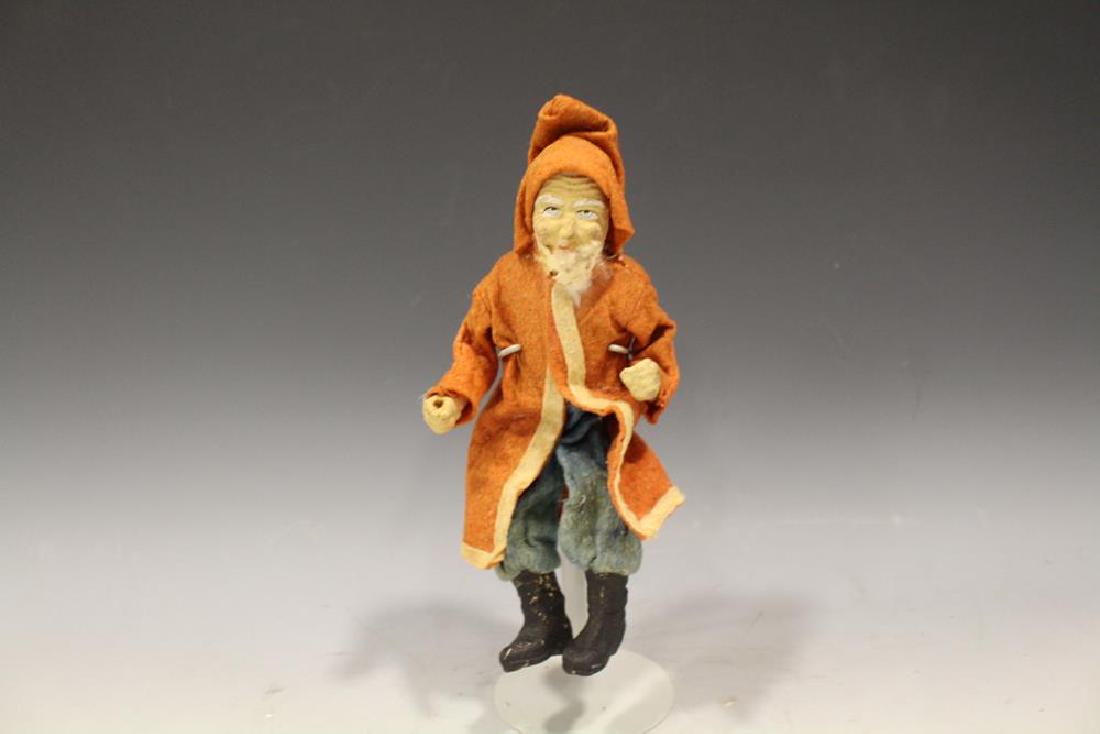 Santa Claus in Red Felt Robe, Wired Body: Early Santa Claus dressed in felt of red robe, blue pants and hood, wired body in seated position probably sat in a large sleigh, painted composition face and hands, 9" H as in wired current position.