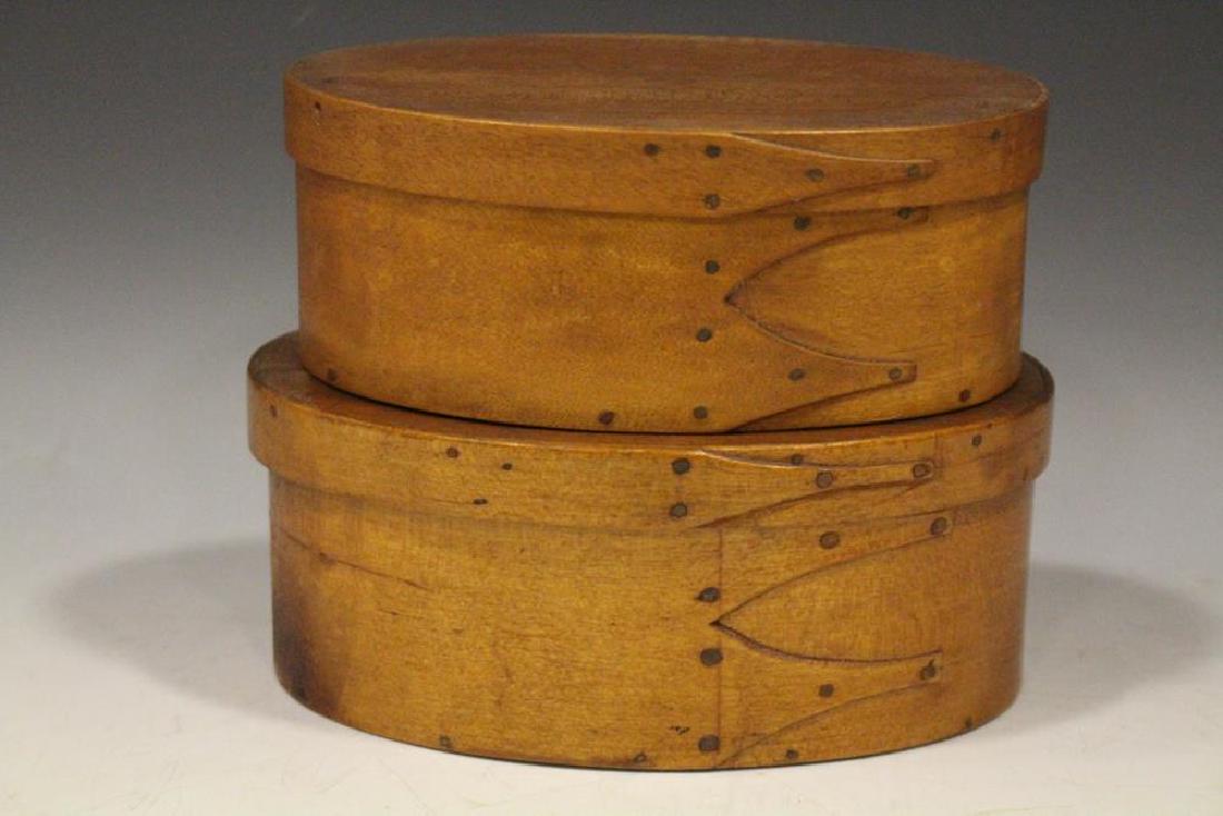 Matched Pair of Shaker Oval Pantry Box w/ Finger Laps: Lot of 2 matched Shaker oval pantry boxes, lids with single finger lap, boxes with double finger laps - largest 6 1/2" W with tight split; smaller 6" W, very good condition.