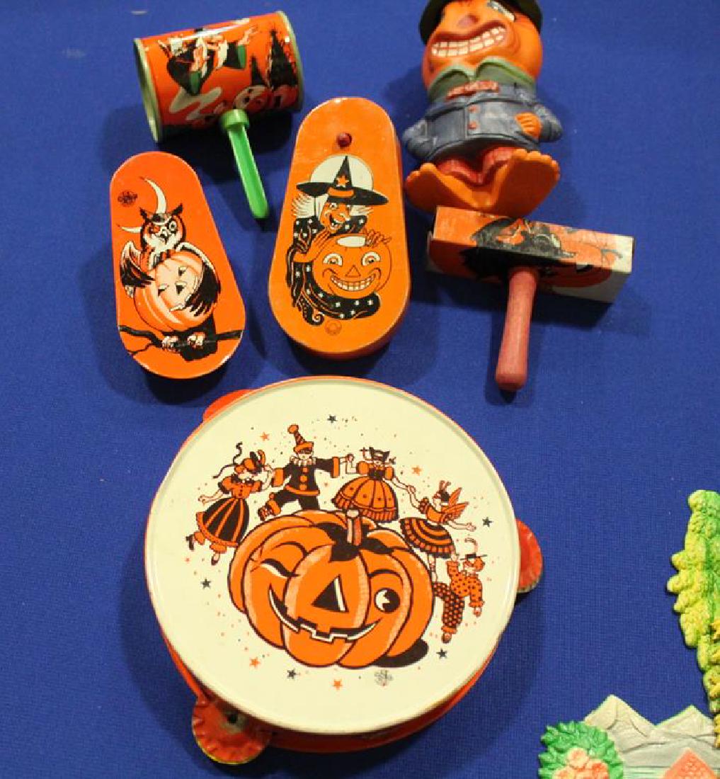 Halloween Tin Lithographed Noisemakers: Halloween tin lithographed noisemakers - tambourine, 6 1/2" W; two spinners; 2 shakers; includes contemporary candy container, 6" H.