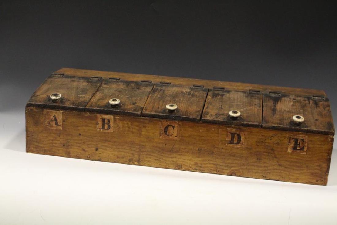 19th C. Grain-Painted Mercantile Store Lift-Lid Spice: 19th C. mercantile store countertop grain-painted 5-section spice box with paper labels lettered A-E, 6 1/2" H X 27" L X , 10" D.