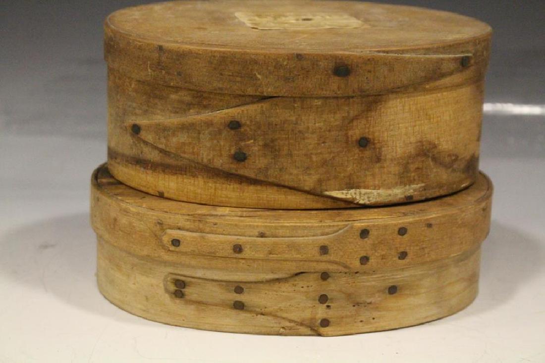 19th C. Oval Pantry Boxes: Lot of two oval pantry boxes - tallest, 2 1/2" x 6 1/2" W with hand-written paper label on lid and on reverse, both with single finger laps on lids and bases.