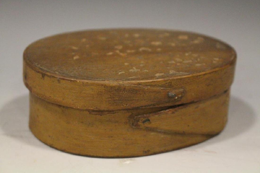 Small Tan Brown Painted Oval Pantry Box: Small oval pantry box, original deep caramel tan / brown painted surface, single finger laps, 4 1/2" W x 1 1/2" H.