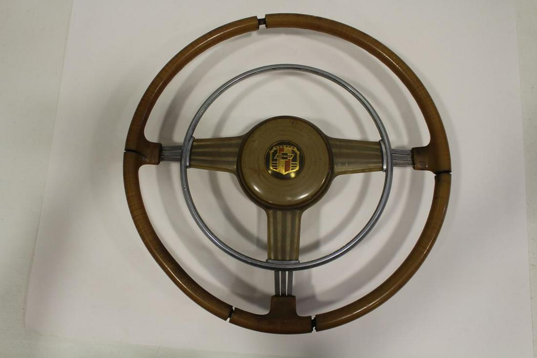 1930-40s Chevy Banjo Steering Wheel: 1930-40s Chevy Banjo Steering Wheel complete with horn ring and button with Chevy emblem, Bakelite and chromed metal, 17 1/2" W. Separations at joints and a crack on left side.