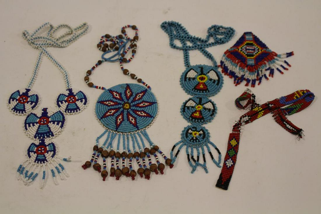 American Indian Beadwork Necklaces: 3 American Indian handmade beadwork necklaces, in excellent condition, and one partially detached necklace; #1, 6 1/2" turquoise beaded pendant hangs from a 22" turquoise beaded chain necklace; #2, 5
