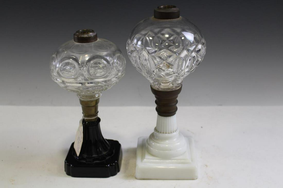 Blown Glass Stand Lamps - Bk Amethyst Base: Blown glass stand lamps, 19th century, one tagged "Ring Punty Sawtooth Eye & Leaf" on black amethyst base, 9 1/2" H, good condition.