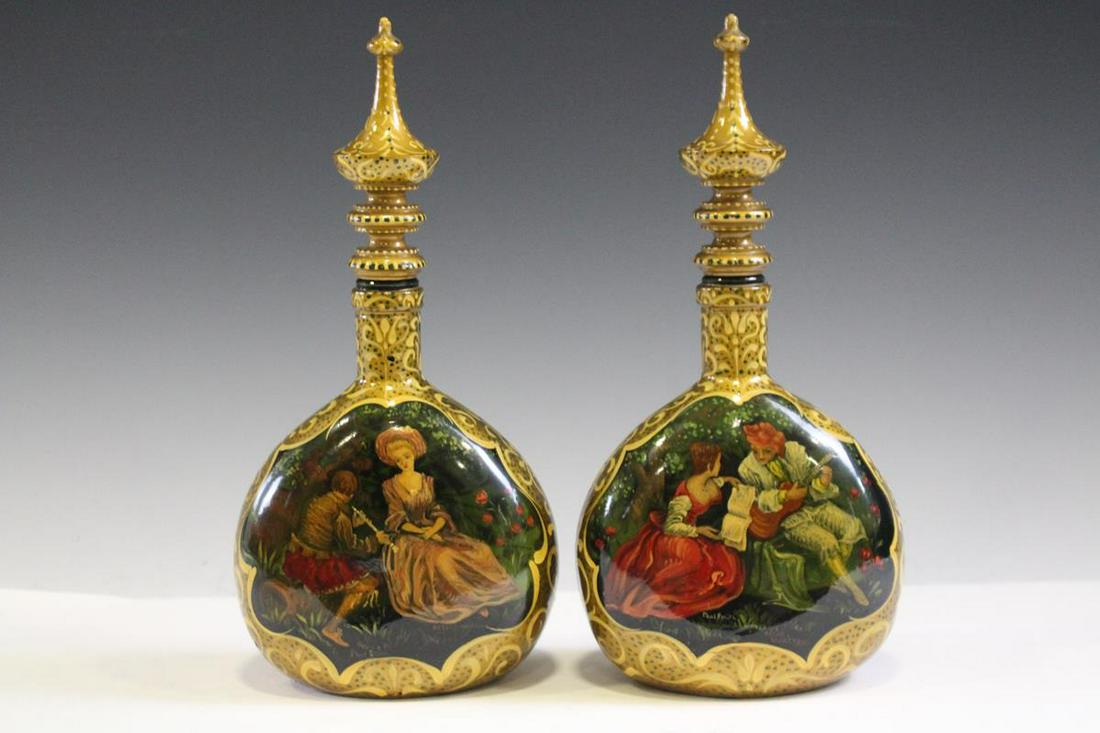 Pr Hand-Painted Enamel Decanters: Pair hand-painted enameled decanters, signed "Paul Smith after Watteau" with original stoppers, 11 1/2" H, very good condition. The bottles are green glass with enameled painted designs. The stoppers 