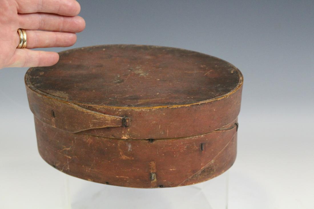 Oval Pantry Box - Single Finger Lap: Oval pantry box, top and bottom with single finger laps secured with original wire brads / staples, 9 1/2" L x 3 1/2" H.