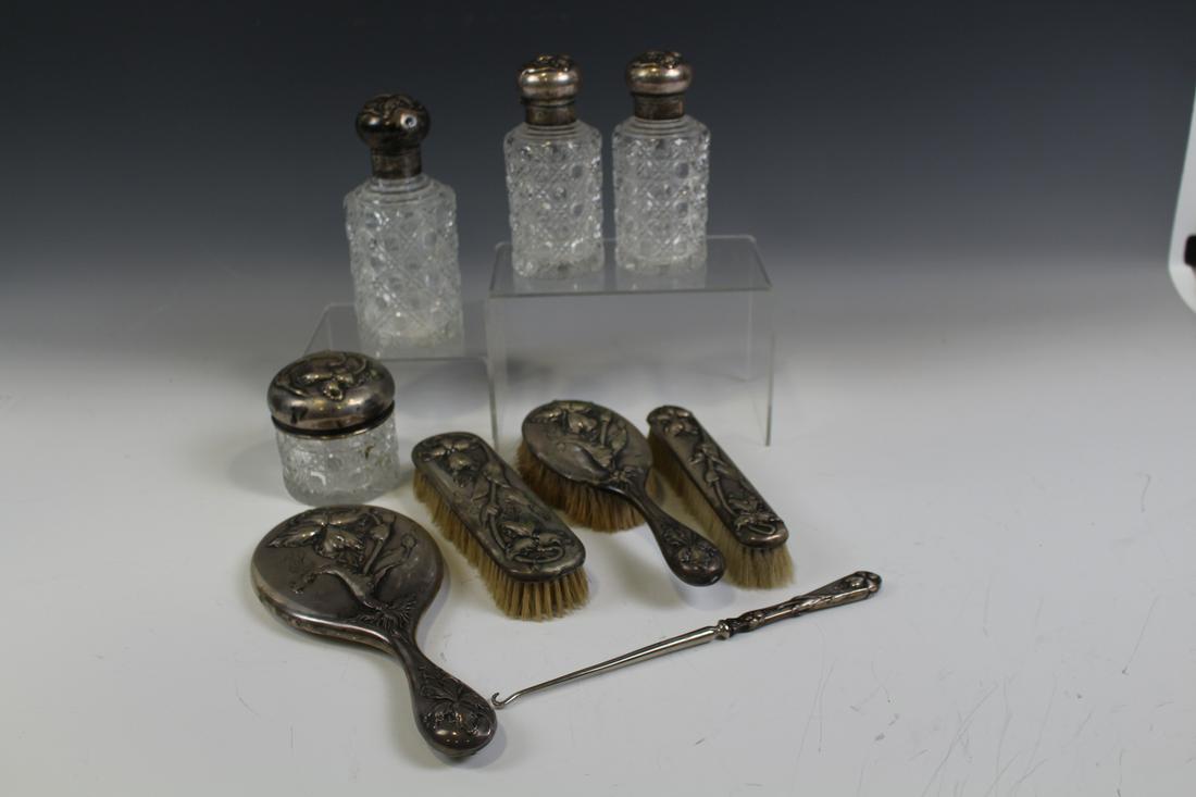 9-Pc Victorian Dresser Set 800 Silver & Cut Glass: 9-piece, 800 silver dresser set, all matching with embossed orchid flowers - 3 cut glass perfume bottles, tallest 7", cut glass powder jar, 3" H; shoe button hook; 2 brushes; hair brush and hand mirro