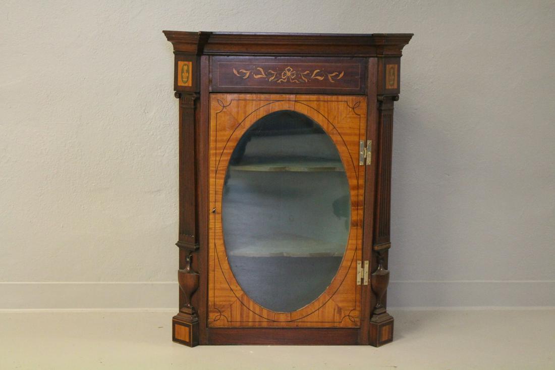 19th C Hanging Corner Cabinet: Late 19th century wall / hanging corner cabinet, mahogany and satinwood inlays, door with "H" hinges, interior with two blue shelves, 38" H x 29" W x 16" D. No in-house shipping.