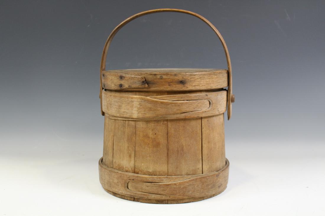 Shaker Firkin Buttonhole Laps Quality Construction: Shaker buttonhole / button hole lapped finger bands firkin, quality solid oak stave construction, pegged bent wood handle, 9 1/2" H plus handle.