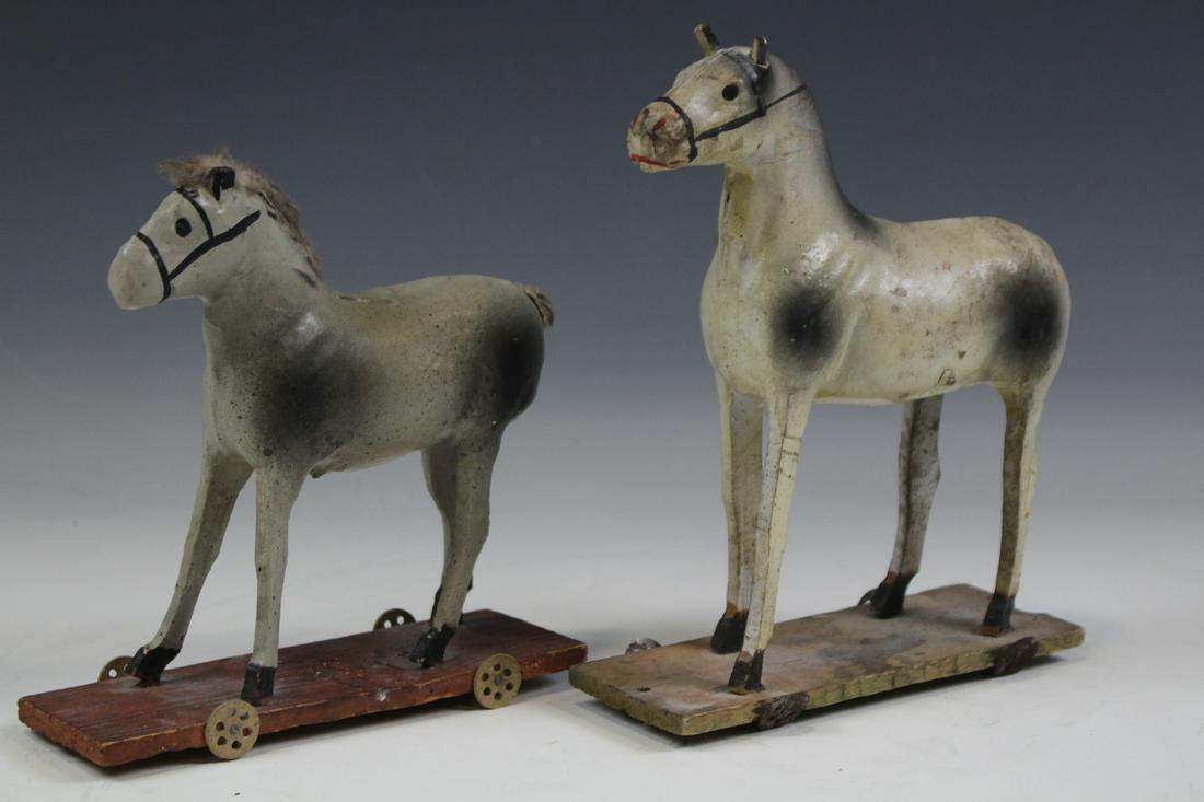 Horse Pull Toys Marked Germany Paper Mache: Lot of two 19th to early 20th century pull toy horses, stick legs and stick ears, marked on wooden base, "Germany", papier / paper mache / gesso / composition, one lacking original hair tail, smaller 
