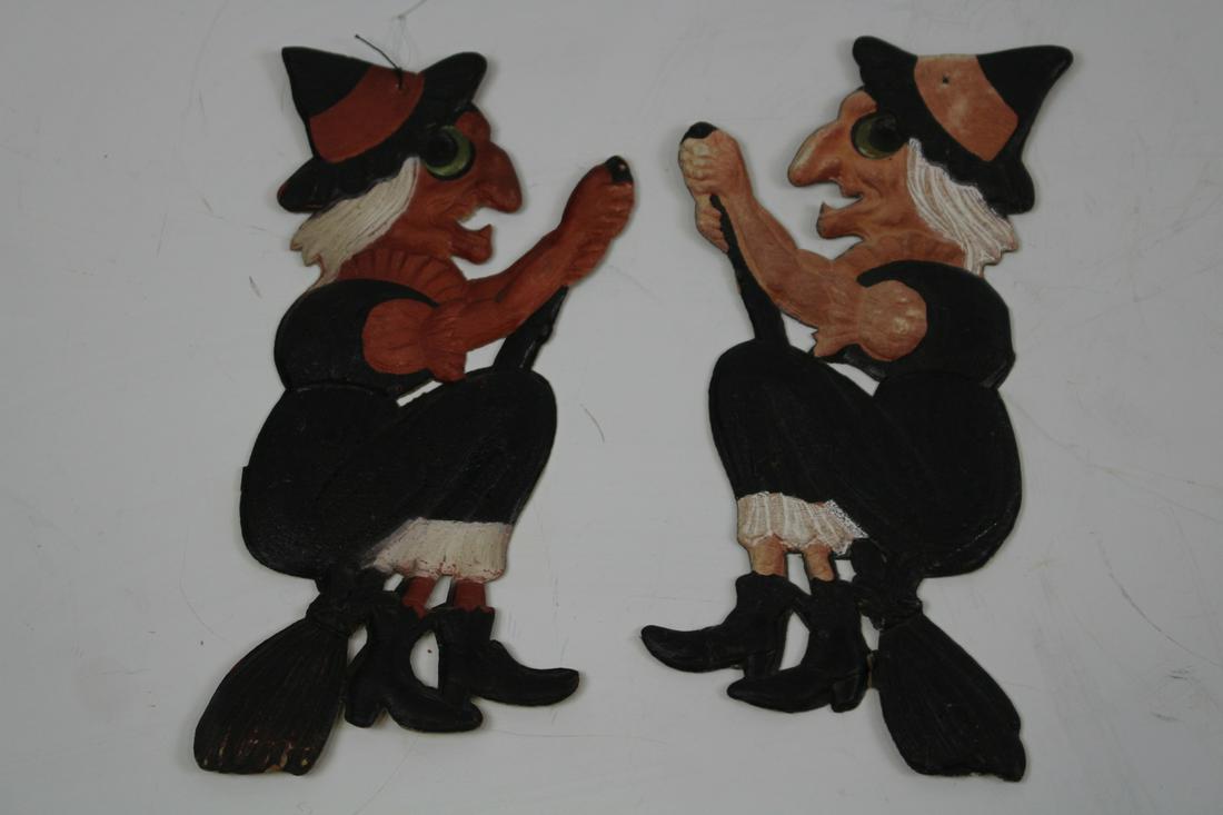 Halloween Witch Diecuts Marked Germany 1930s: Pair Halloween witch diecuts, marked "Germany", circa 1930s, 8" H, very good condition, lighter orange one has a slightly weakened broom joint but still secure.