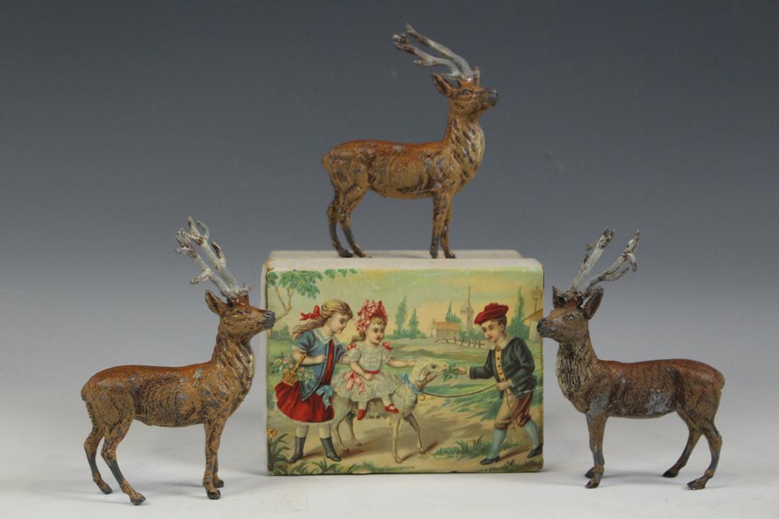 Cast Metal Reindeer Christmas Deer: Lot of 3 cast metal / iron / lead painted reindeer / deer, Christmas holiday, 4" H, very good condition, Victorian storage box that held the deer with lithographed children and sheep on the lid, 4 1/2