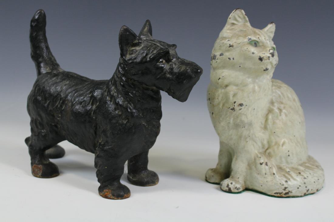 Doorstops -Cat & Dog: 2 doorstops - white cat and Scottie dog.