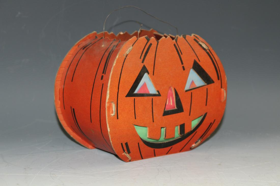 Heavy Cardboard Jack-o-Lantern Pumpkin: Wire handle, interior holds paper features on front and back sides, interior used candle, vey good condition. No issues noted other than moderate wear consistent with age and normal use.