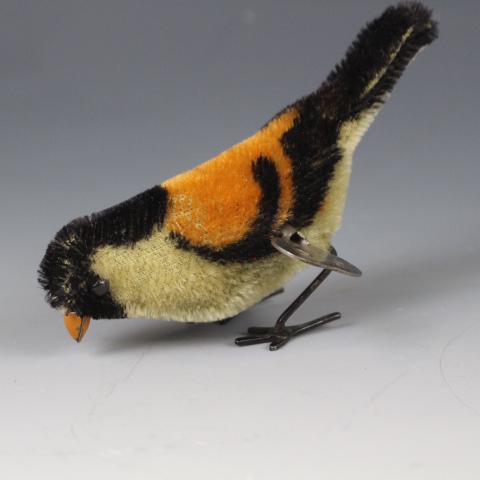 German Schuco 1940'sWind-up 905 Pick Pick Bird: Made in Germany by Schuco, 1940's mohair covered tin wind-up "905 Pick Pick Bird", 5" L. No issues, winds easily and working.