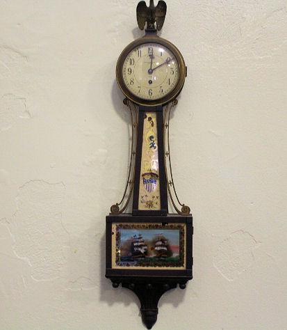 Chelsea Banjo Clock w/ Constitution & Guerriere Ships: Reverse-Painted Mahogany Chelsea Banjo Clock made for the Abercrombie & Fitch showrooms, eglomise reverse painted tablet with image of ships USS Constitution (flying the American flag) & Guerriere, ea