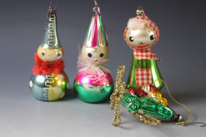 Group of 4 Christmas Ornaments = Clowns, Airplane: Group of 4 Christmas Ornaments - 1) airplane with Santa, 3 1/2" L; paint hand painted clowns, 5" H; German lady in checkered scarf. No issues.