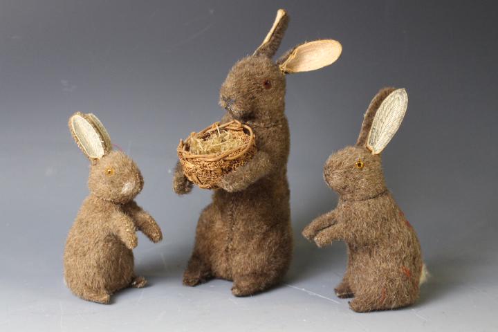 1920-40s Easter Rabbit Family Candy Containers: Lot of Easter Holiday Bunny / Rabbit Candy Containers - Papier / paper mache with brown mohair faux fur, largest holding Easter basket, removeable heads, glass eyes, paper ear lining, white fur tails.