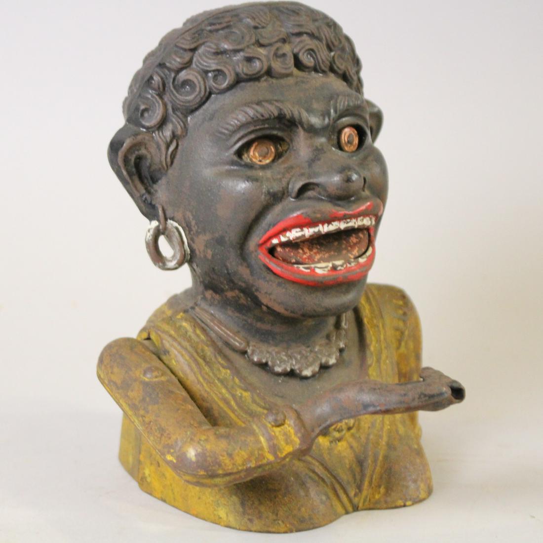 C1911 Dinah Long Sleeve Mechanical Bank: Circa 1911 Dinah Long Sleeve Mechanical Bank by John Harper â€“ 6 1/2" H, working, original coin trap, paint loss.
