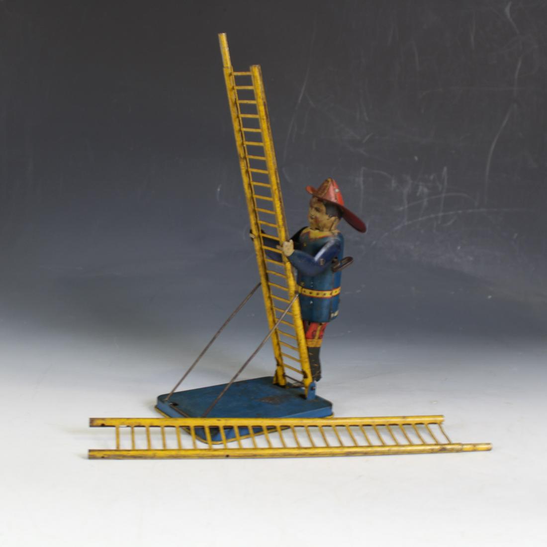 C1930s Louis Marx Tin Wind-up Climbing Fireman (1 of 3)