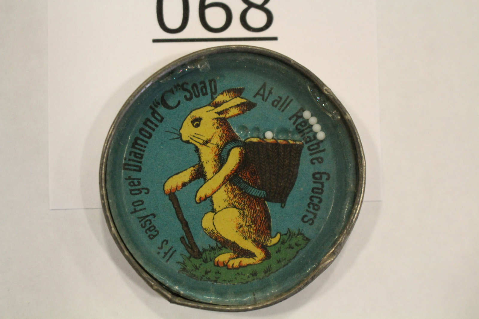 Diamond Soap Advertising w/Rabbit Dexterity Game: Advertising dexterity game / handheld puzzle game with image of a rabbit and ad for Diamond Soap, "It's Easy to Get Diamond "C" Soap At All Reliable Grocers" in circle around large rabbit with back pa