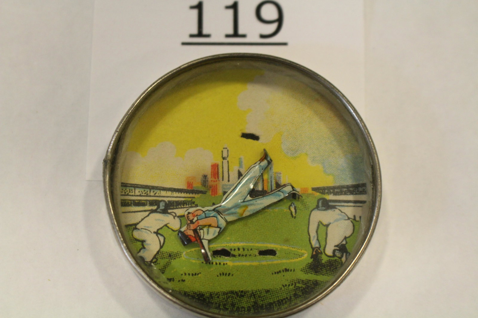 Baseball Players w/ Die Cut Batter Dexterity Game: Sports-related dexterity game / handheld puzzle game with image of a baseball game inside a stadium with city skyline in background, hard challenge is to get the metal die cut batter hinged, metal fra
