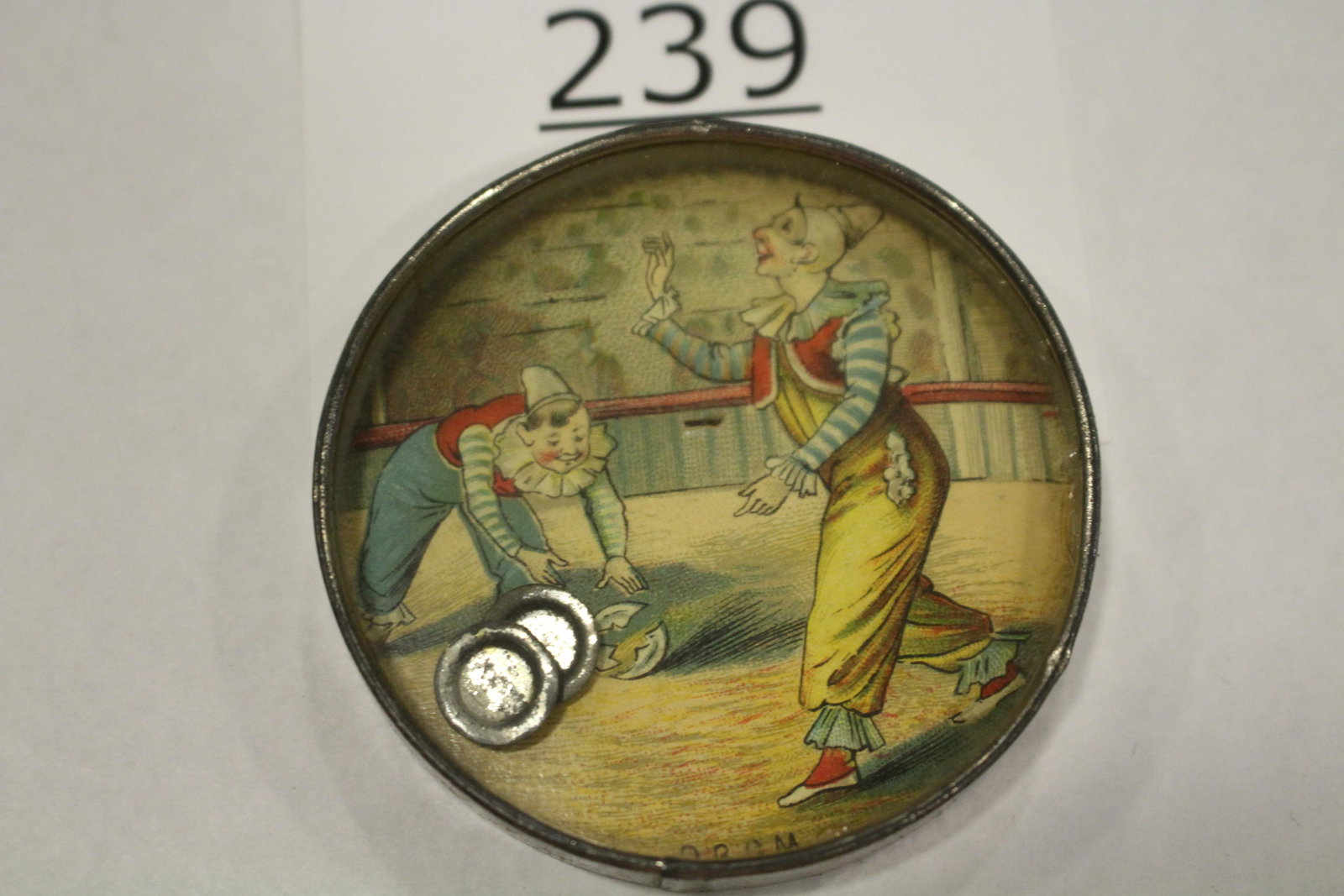 Circus Clown Juggling 3 Plates Dexterity Game: Dexterity game / handheld puzzle game with image of a circus clown juggler, challenge is to hook three metal plates in the jugglers hands, metal frame, mirrored back, 2 1/2" W. Good.