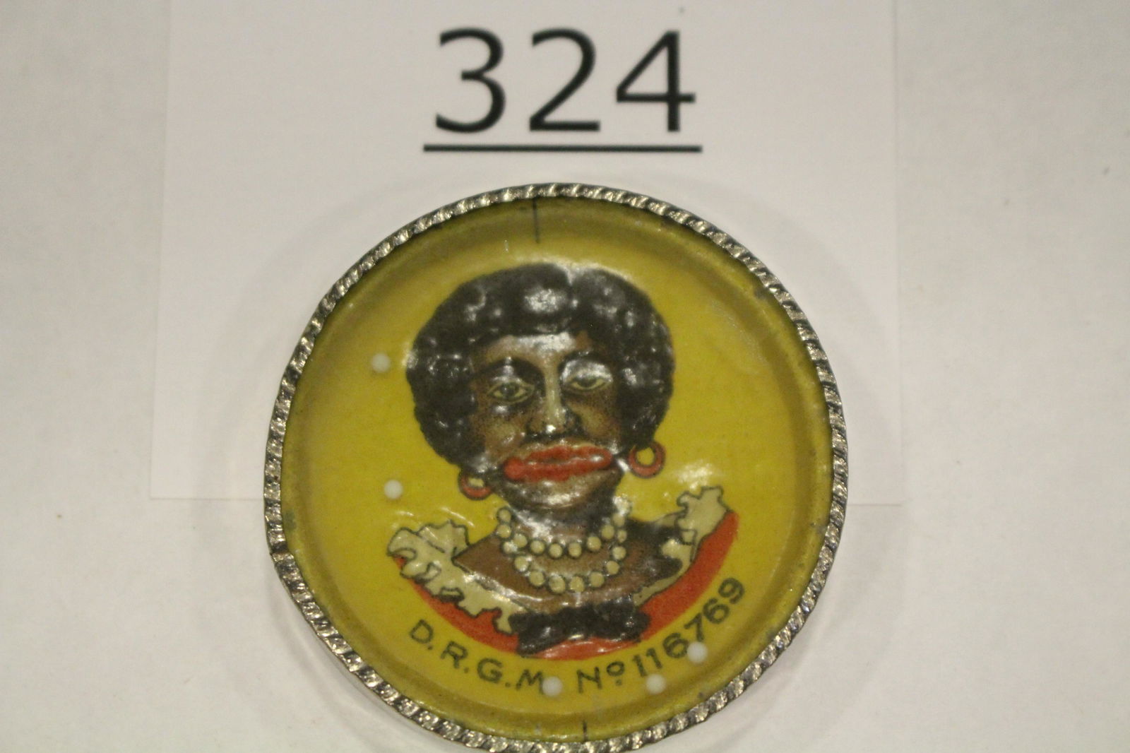 Advertising Oils Black Woman Dexterity Game: Advertising oils and greases dexterity games / handheld puzzle game with an embossed image of a black Americana woman's portrait, back label "COMPLIMENTS OF RICHARDSON LUBRICATING CO., MFG OF OILS AND