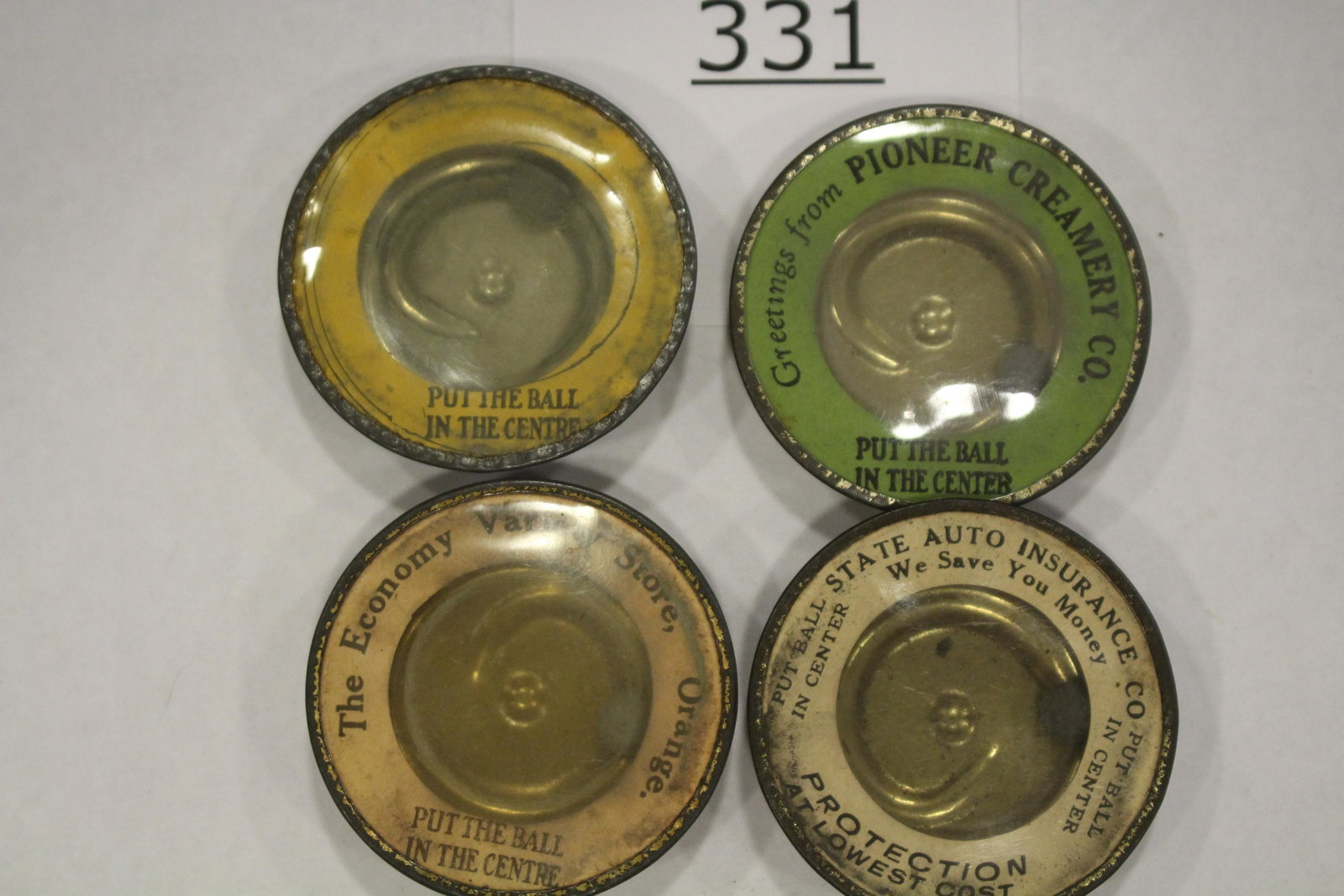 Group of 4 Advertisements Dexterity Games: Lot of 4 advertisements dexterity games / handheld puzzle games with front labels and all metal construction, 2"; 1) THE ECONOMY VARIETY STORE; 2) PIONEER CREAMERY; 3) STATE AUTO INSURANCE, 4) PUT THE