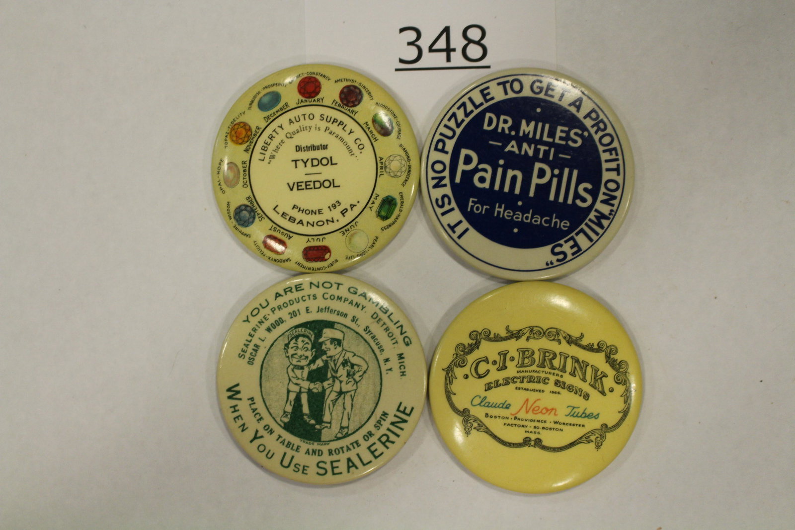 Group of 4 Advertising Celluloid Dexterity Games: Group of 4 celluloid advertising dexterity games - 1 ) C-I-BRINK NEON SIGNS, BOSTON; 2) DR. MILES ANTI-PAIN PILLS, SEALERINE, men shaking hands; 3) LIBERTY AUTO SUPPLY STORE, LEBANON, PA; opposite sid