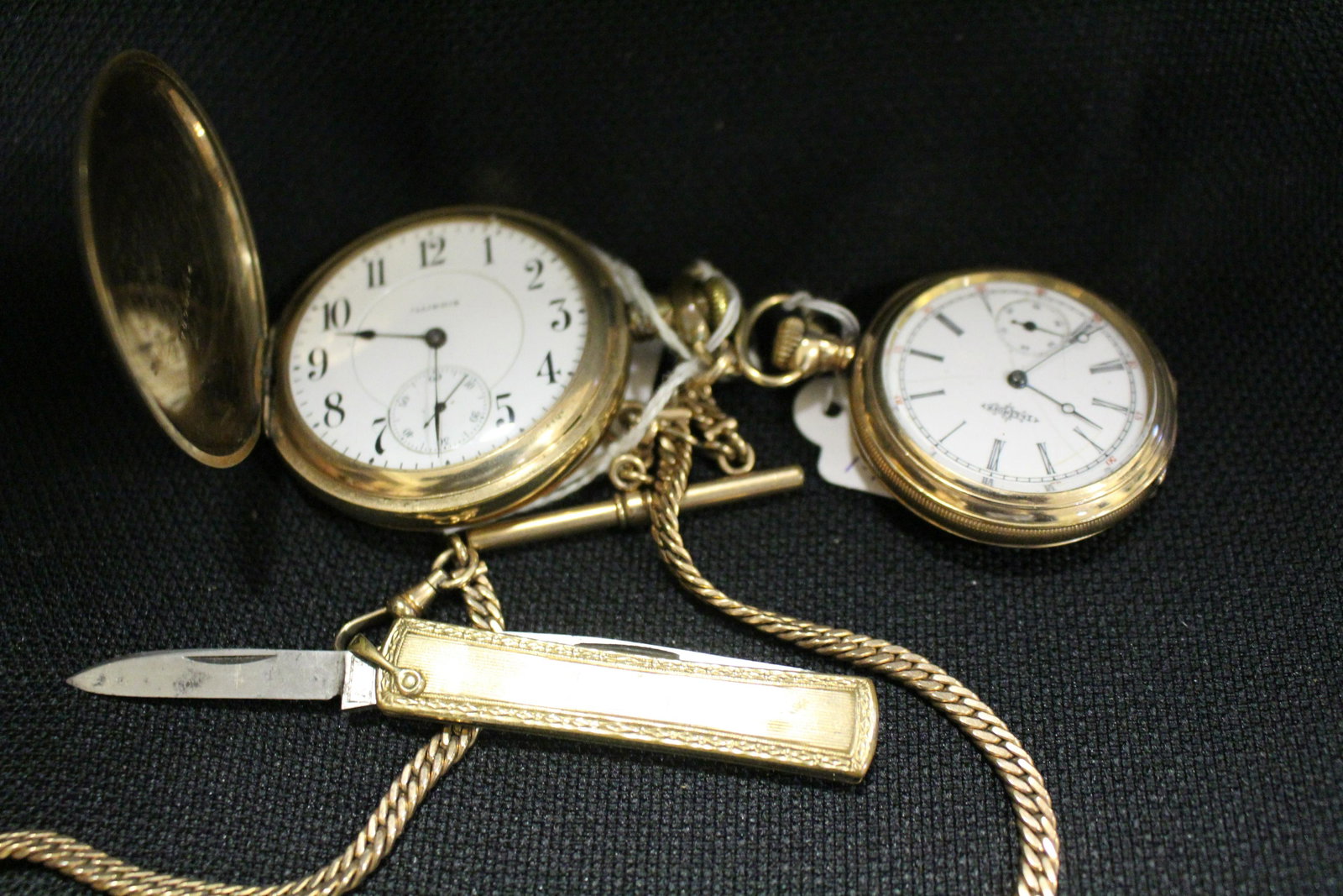 Illinois Watch Co. Pocket Watches w/ Chain HC: Illinois Watch Co. Pocket Watches, Hunter Cases - 1) with watch fob chain and knife fob, hunter's case, 17 jeweled reflectors, 3" W, serial number 2265214, 25 year warranty, running; 2) lady's, 25 yea