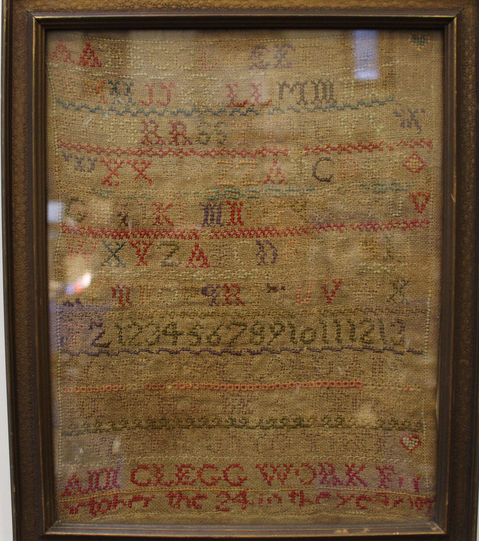 Antique 1807 Ann Clegg Sampler: Antique 1807 Silk on Linen School Girl ABC Sampler - wrought by Ann Clegg, ''â€¦ 24th in the year '07'', framed 13 x 10''.