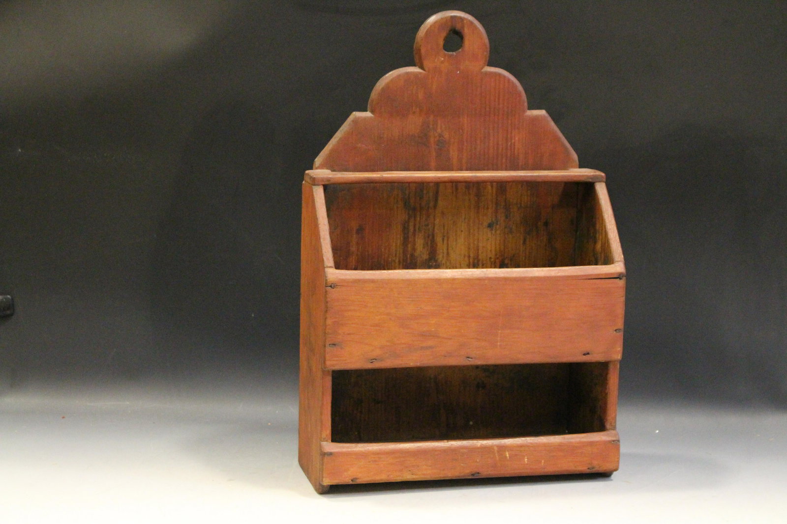Early Wall Box in Old Red Paint Cut Nails: Early Wall Box - 2 compartments plus bracket at top probably for spoons, pine with cut nail / square nail construction, 20 1/2'' H 13 1/2 W x 5 1/2'' D. No issues.