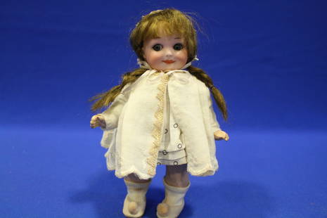 1925 A.M. 7" H Googly Eyes Bisque Doll, 25311/0 N1: 1925 A.M. Googly Doll, 25311/0 N1 - 7" H, bisque socket head, blue glass sleep eyes, brown mohair wig, all composition body, cape and bonnet over dress. See other good dolls selling later in this