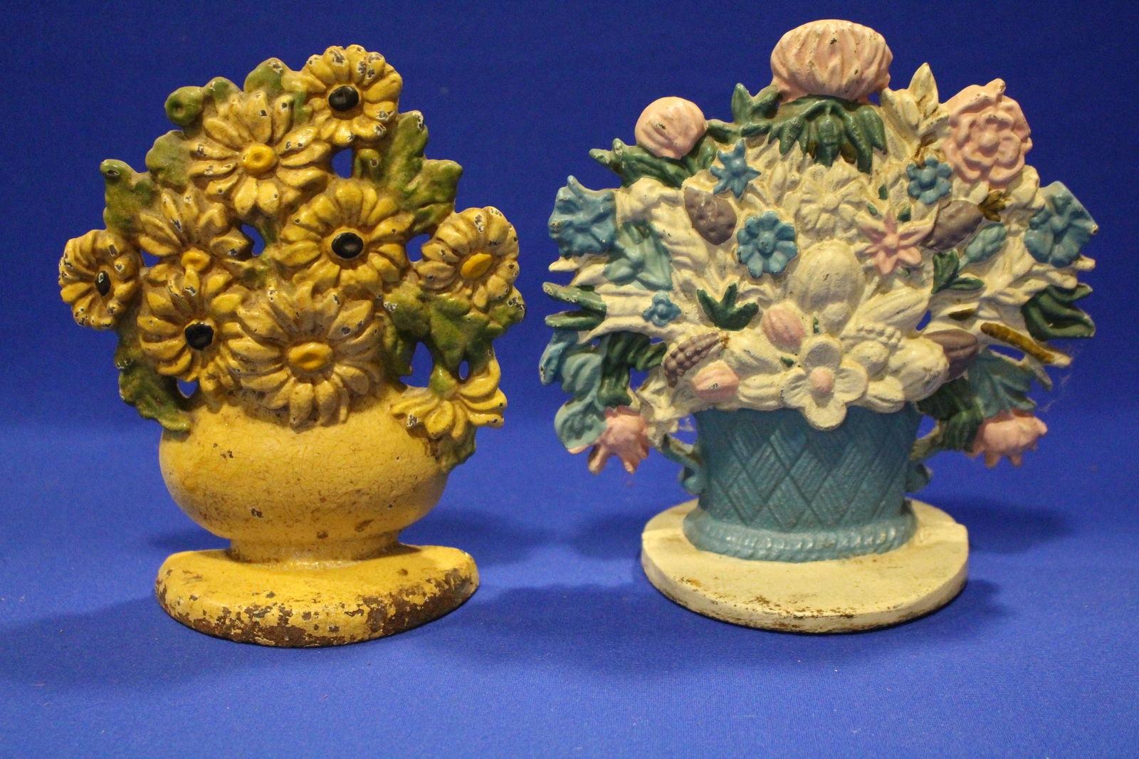 Lot of 2 Cast Iron Flower Basket Door Stops: Lot of 2 Cast Iron Flower Basket Door Stops / Doorstops - 7" H.
