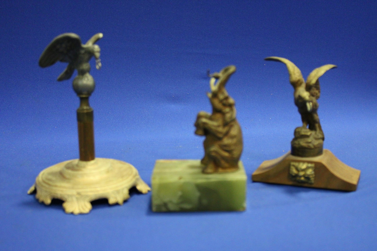 Eagles and Elephant Pocket Watch Holders: Eagles and Elephant Pocket Watch Holders / Hutches - tallest eagle, 6 1/2" H; elephant with tusks on onyx plinth, 5" H