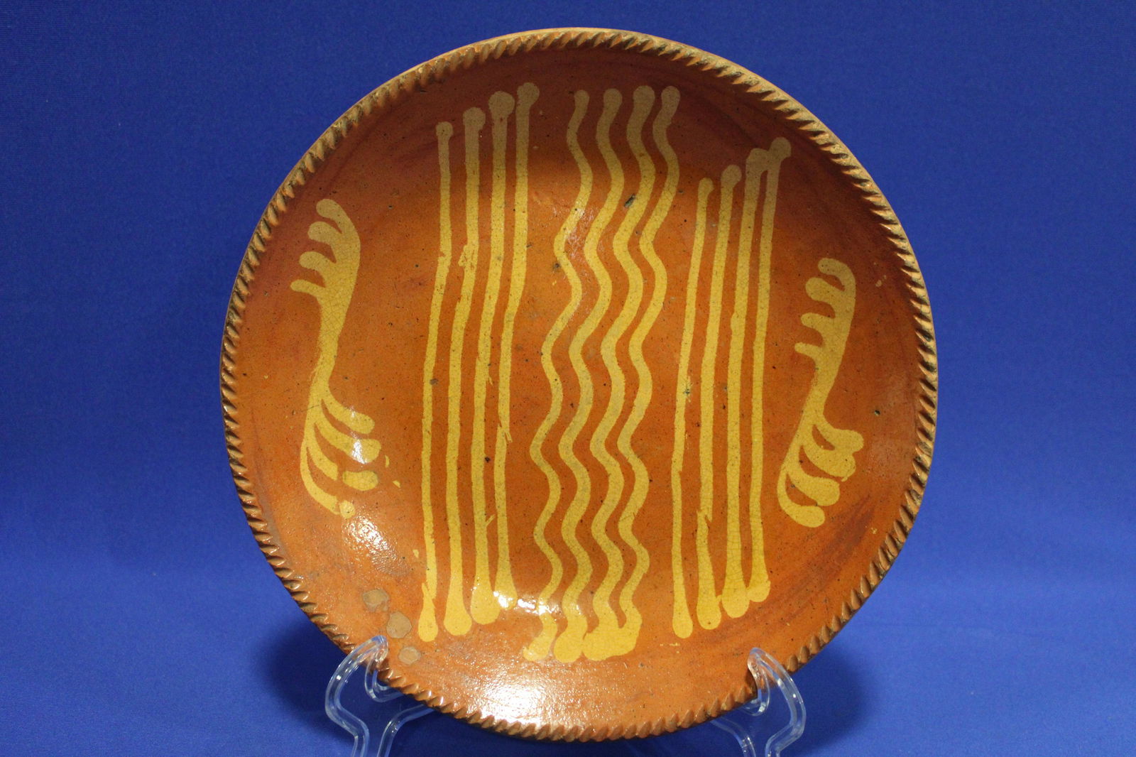 19th C Pennsylvania Redware Charger: 19th C Pennsylvania Redware Charger - yellow slip decoration, coggle wheel / piecrust edge, 11 1/2" W. No chips or cracks.